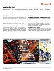 Automobile frames travel down the assembly line through robotic arms.L