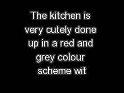 The kitchen is very cutely done up in a red and grey colour scheme wit