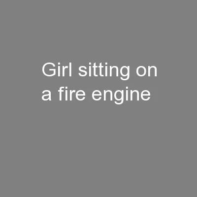 Girl sitting on a fire engine