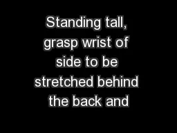 Standing tall, grasp wrist of side to be stretched behind the back and