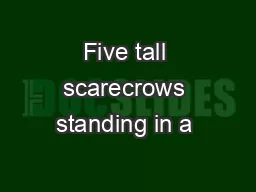 Five tall scarecrows standing in a �eld,